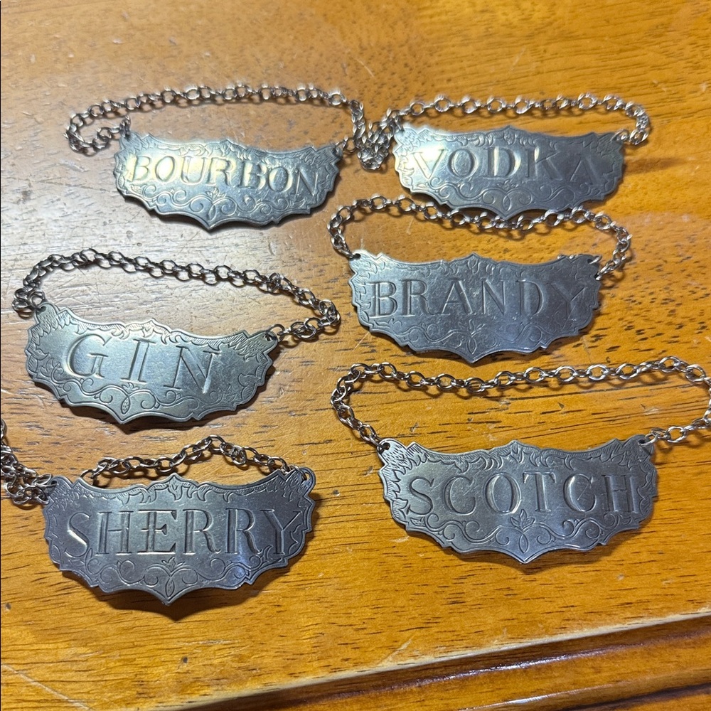 Vintage STIEFF pewter decanter hangers